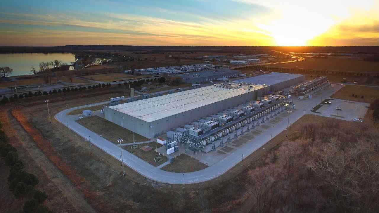 Aerial view of a large data center at sunset