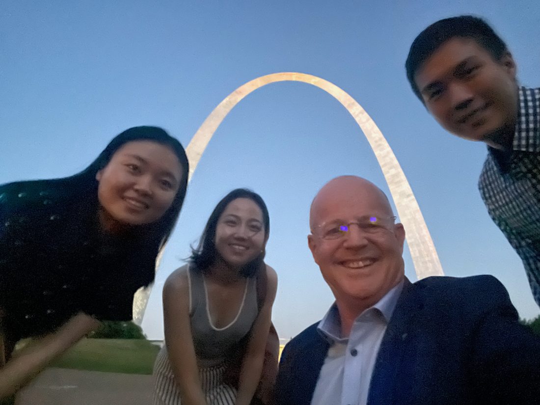 Center director and students in front of the Gateway Arch, St. Louis